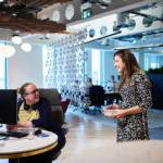 Two laughing women in the office